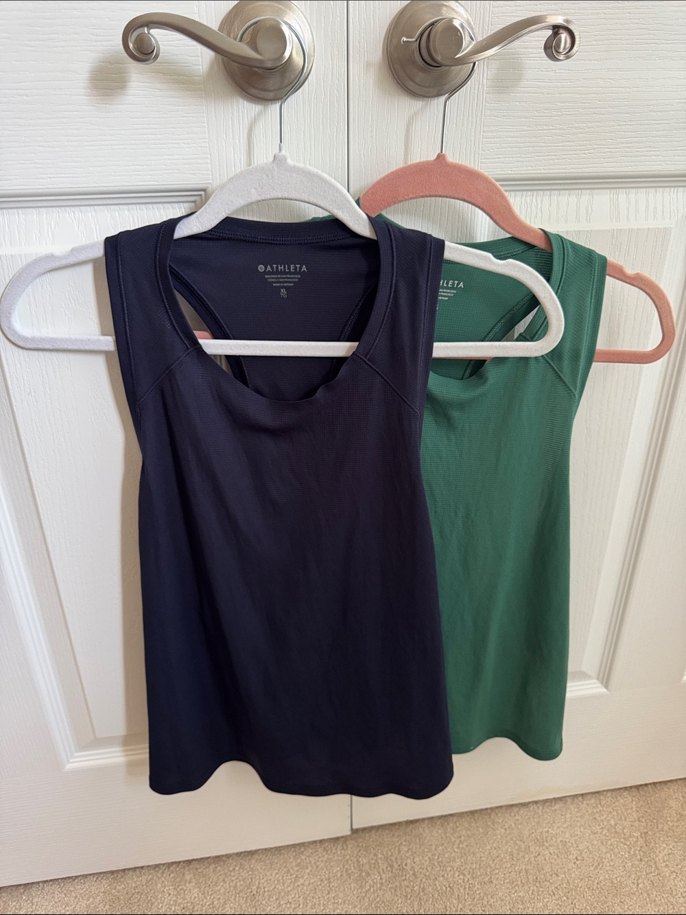 Athleta Tank Bundle. 1 is L and one is XL. Basically the same size.